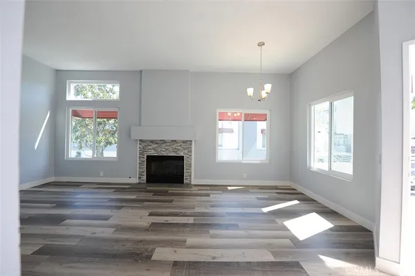 a kitchen with cabinets appliances and a window
