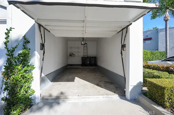 a view of a house with pool and chairs