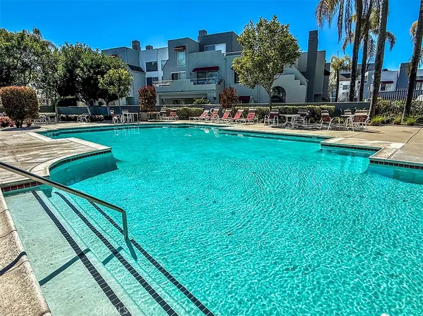 a view of swimming pool with a patio