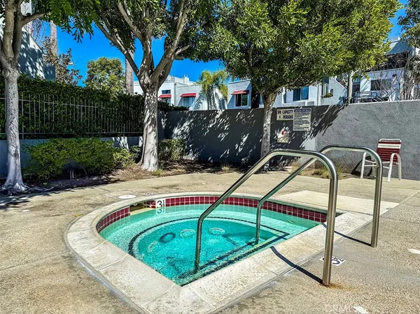 a view of a swimming pool with a patio