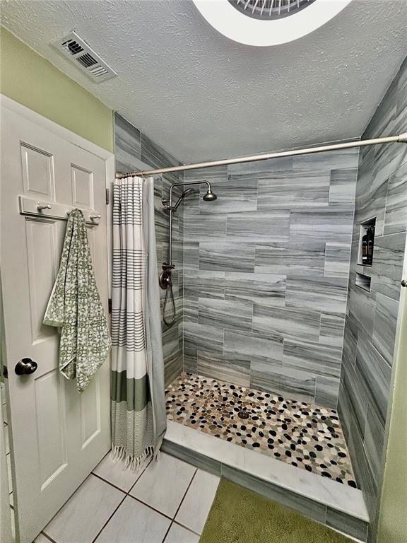8911 Welsh Way Hudson, FL 34667 - Photo 21 of 33 a bathroom with a shower
