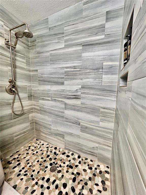 8911 Welsh Way Hudson, FL 34667 - Photo 22 of 33 a bathroom with a shower