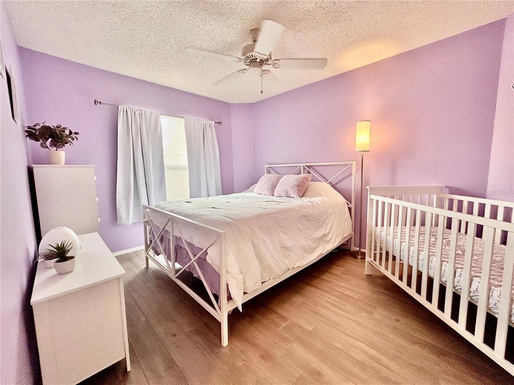8911 Welsh Way Hudson, FL 34667 - Photo 23 of 33 a bedroom with a bed and a window