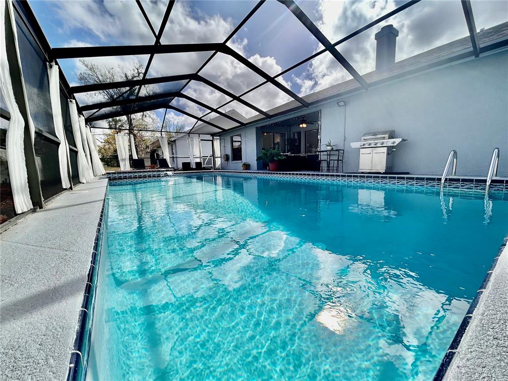 8911 Welsh Way Hudson, FL 34667 - Photo 30 of 33 a view of a backyard of a house