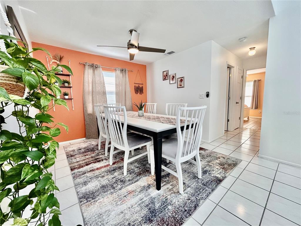 8911 Welsh Way Hudson, FL 34667 - Photo 8 of 33 a view of a dining room with furniture window and wooden floor