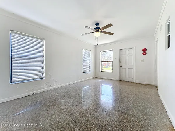 a view of an empty room with a window