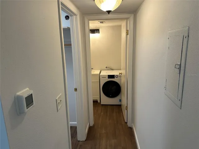 a view of a kitchen with a refrigerator and a stove