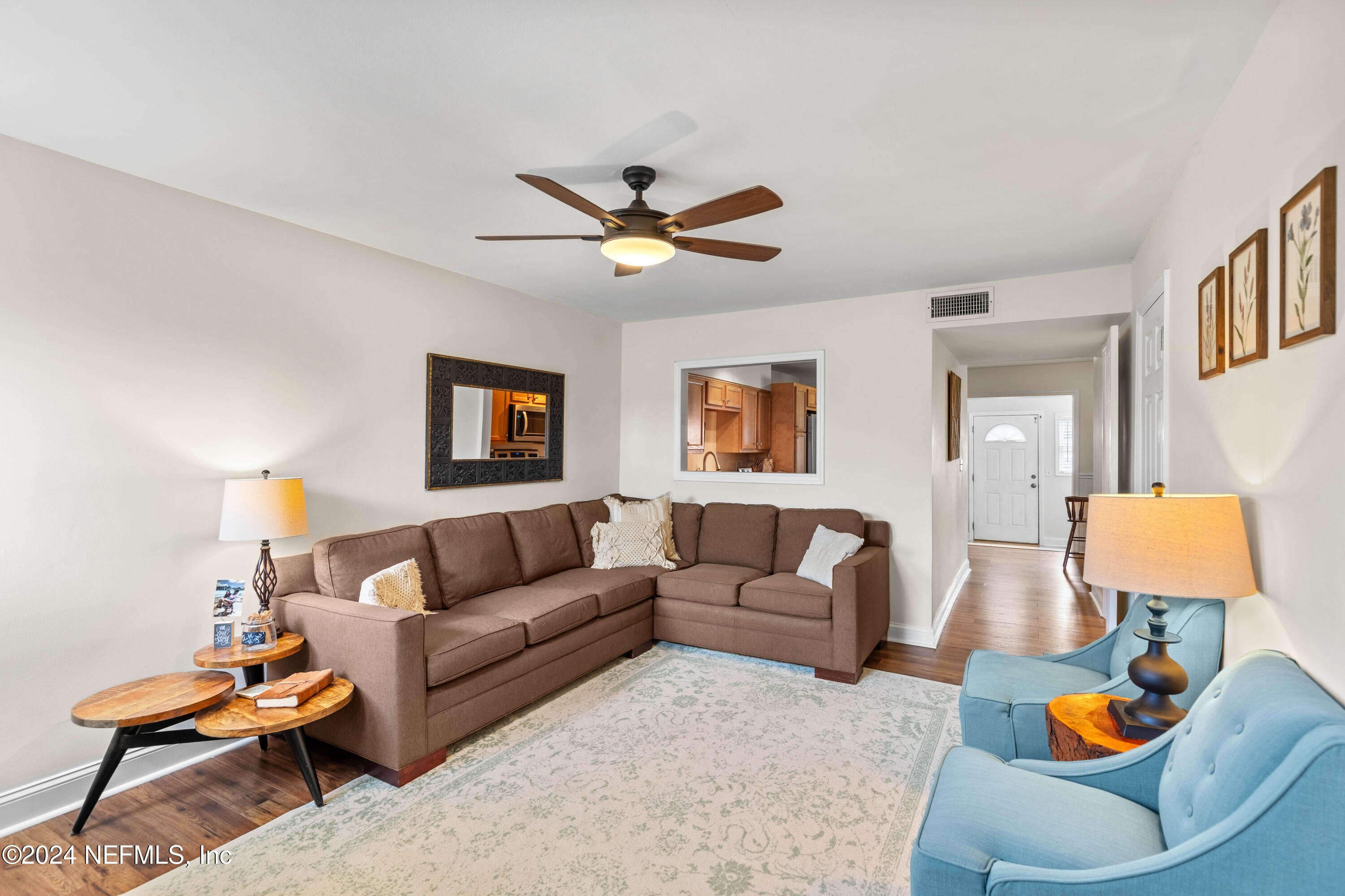 844 Cavalla Road Atlantic Beach, FL 32233 - Photo 7 of 63 a living room with furniture and a lamp