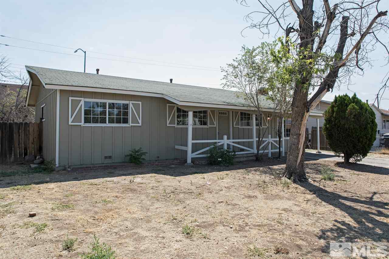 1230 Butler Street Reno, NV 89512 - Photo 1 of 21 a front view of a house with a yard