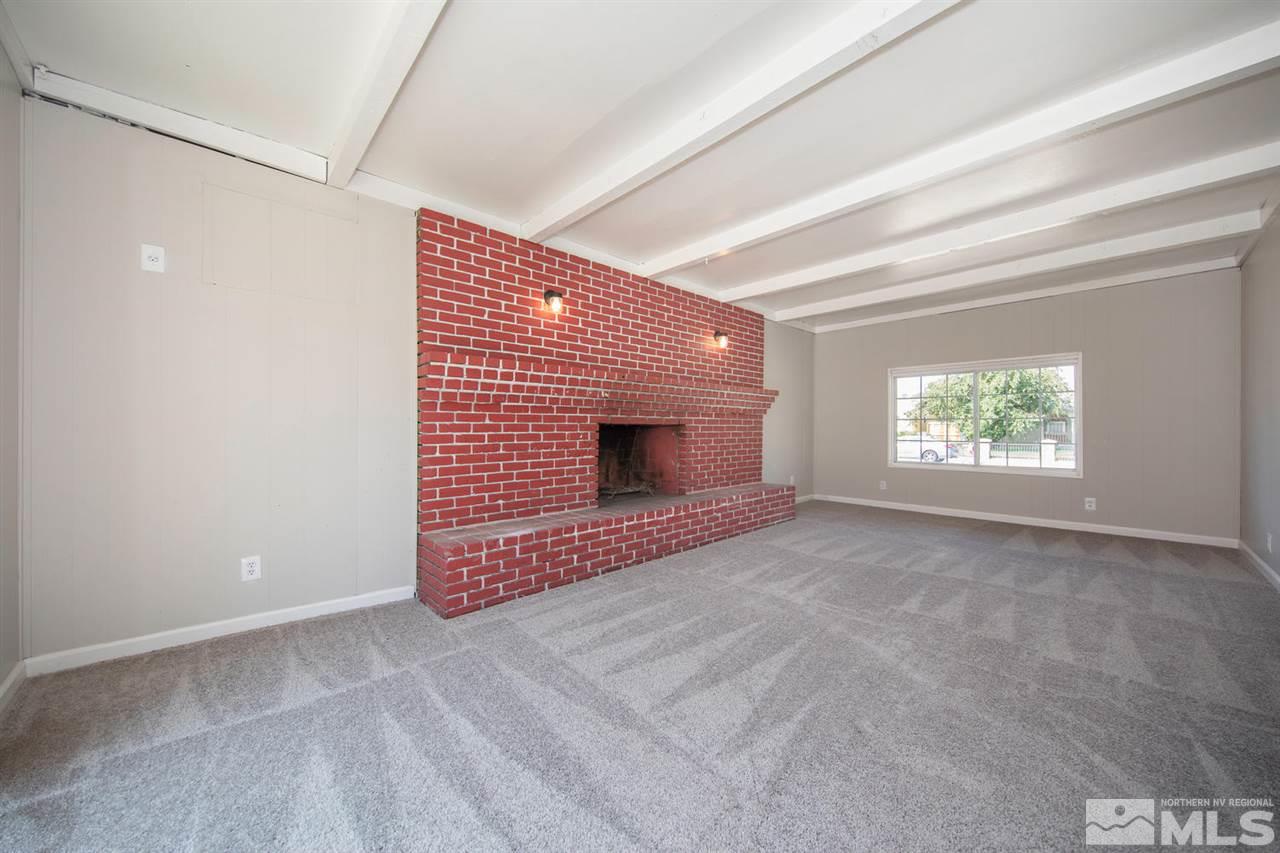 1230 Butler Street Reno, NV 89512 - Photo 11 of 21 a view of an empty room with a window and fireplace