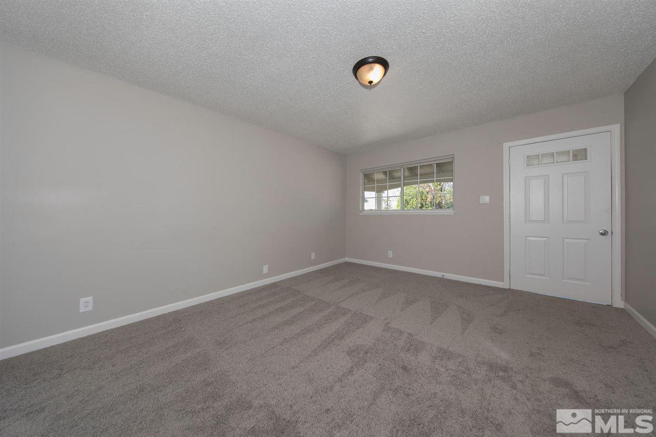 1230 Butler Street Reno, NV 89512 - Photo 4 of 21 an empty room with windows and closet