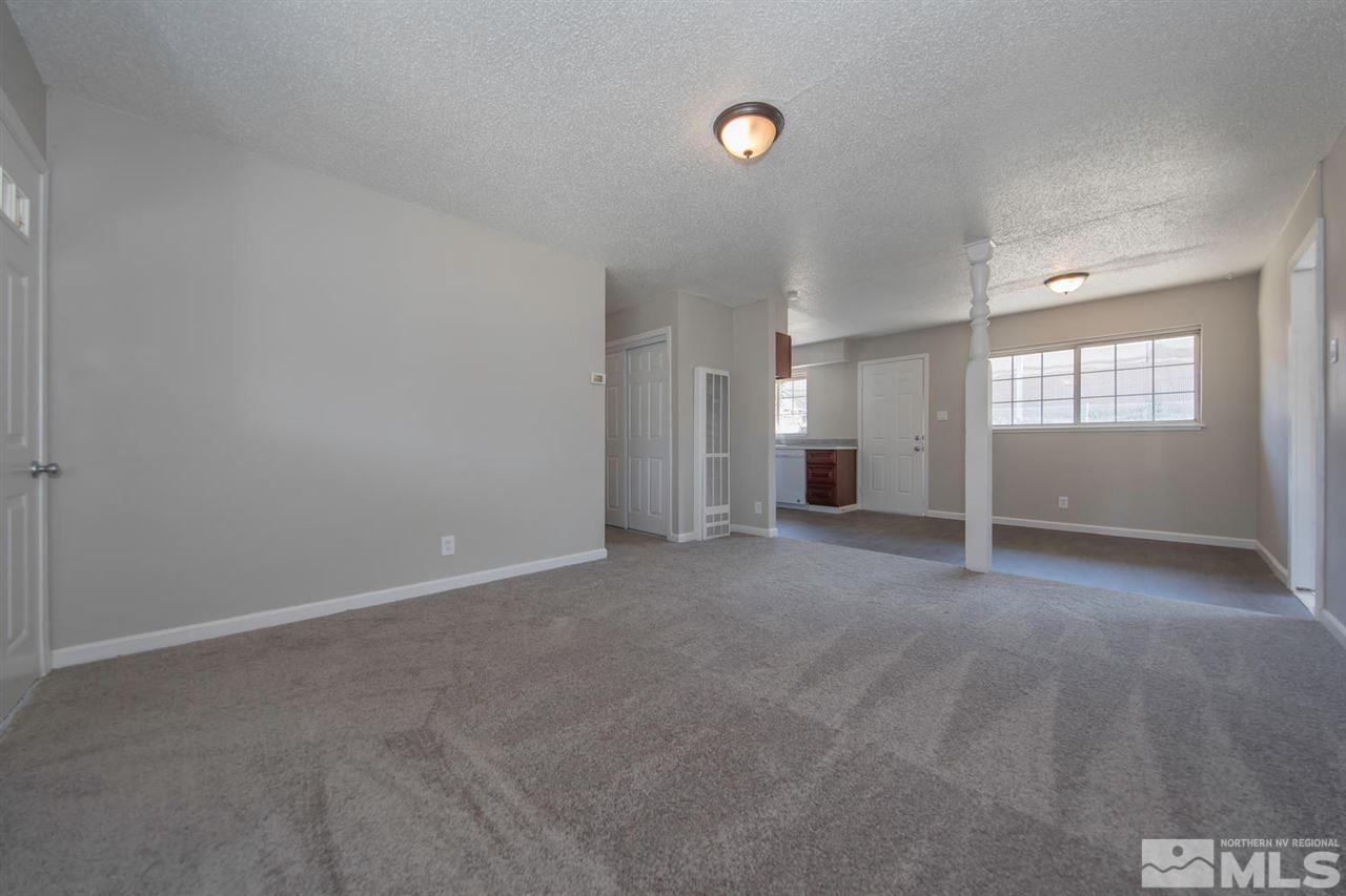 1230 Butler Street Reno, NV 89512 - Photo 5 of 21 an empty room with a empty space and windows