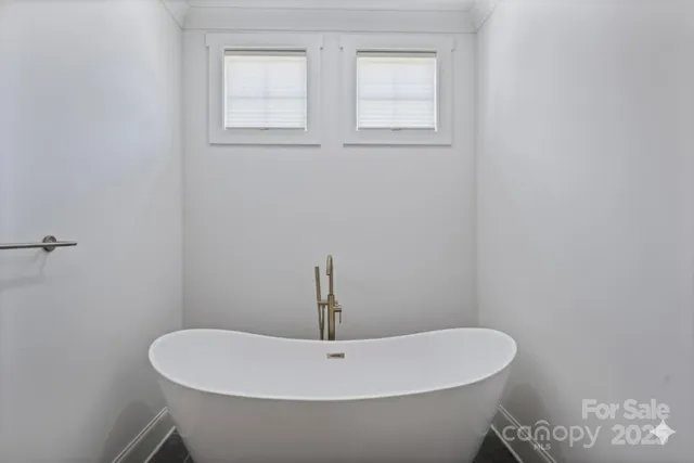 a bathroom with a white sink and a toilet