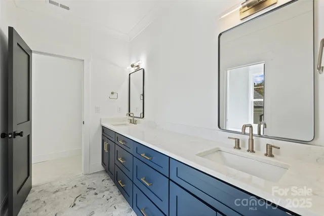 a bathroom with a double vanity sink mirror and double