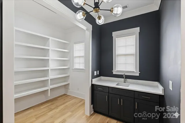 a bathroom with a sink vanity and a mirror