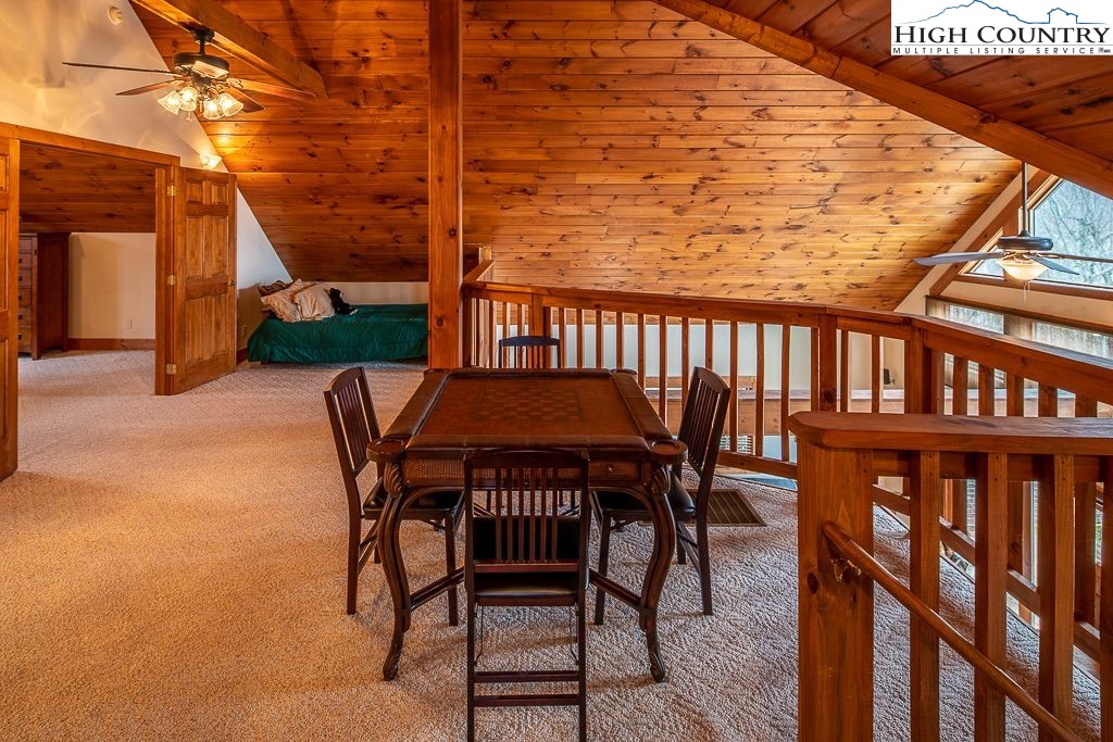 201 Pinnacle Ridge Road Beech Mountain, NC 28604 - Photo 22 of 26 a view of a chairs and table in the patio