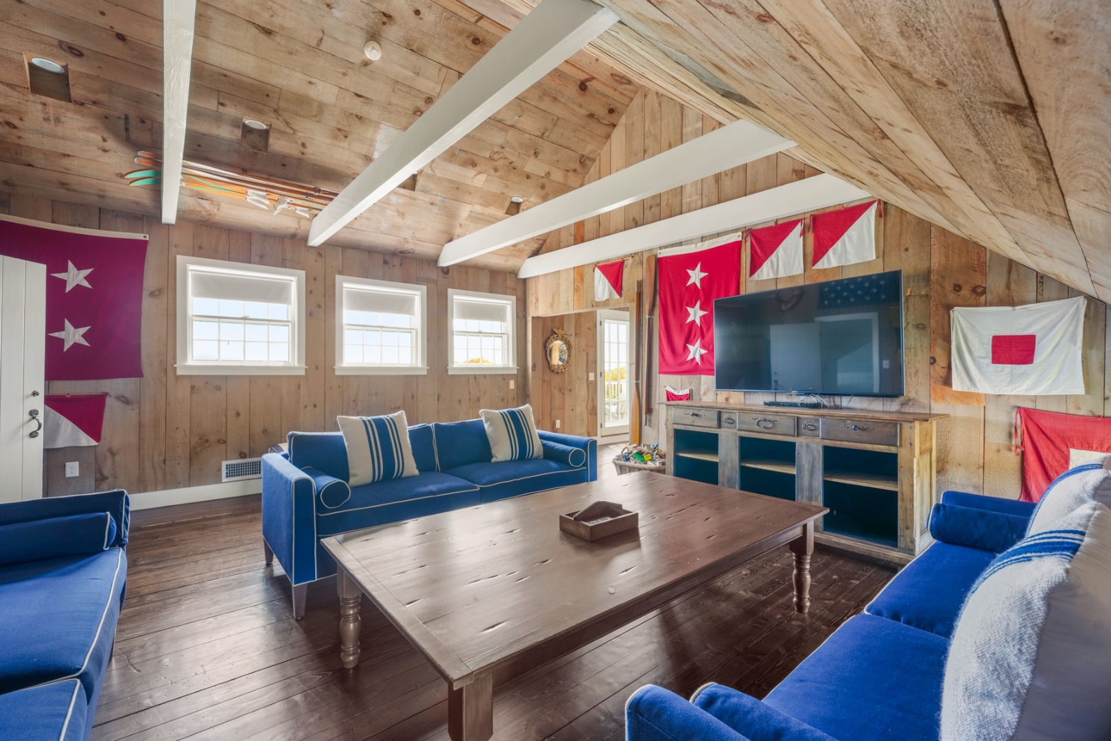 21 Quidnet Road Nantucket, MA 02554 - Photo 23 of 62 a living room with furniture and a flat screen tv