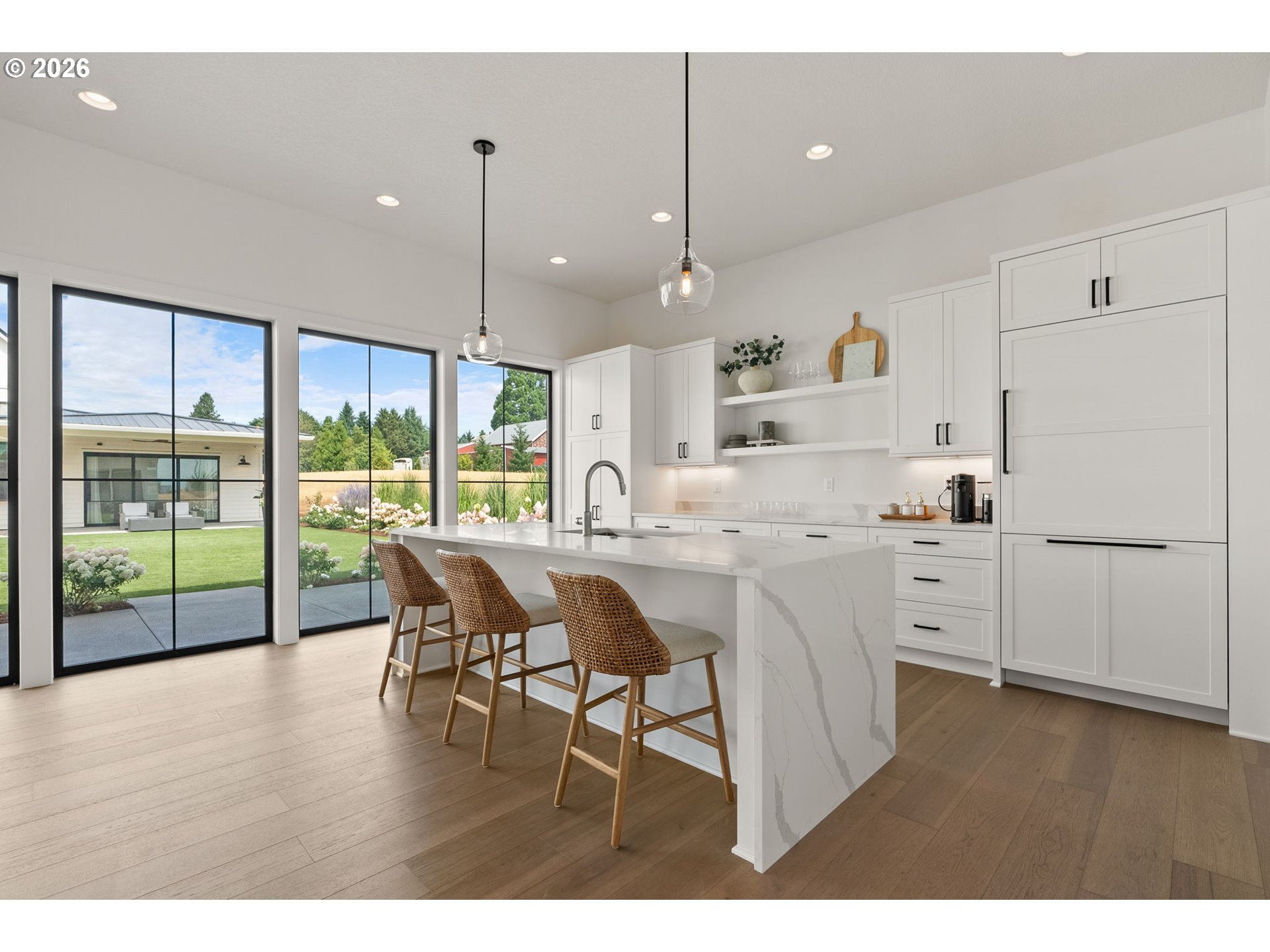 22280 Southwest Stafford Road Tualatin, OR 97062 - Photo 41 of 48 a kitchen with white cabinets and wooden floors