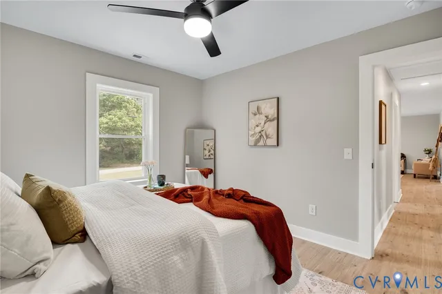 a bathroom with a sink mirror and a bathtub