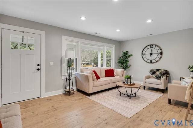 a living room with furniture and a large window