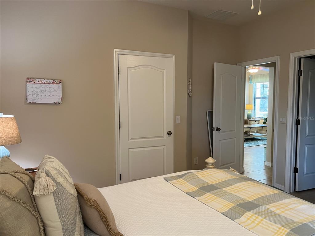 2002 Fishtail Fern Way Ocoee, FL 34761 - Photo 19 of 51 a bedroom with a bed and a view of bathroom