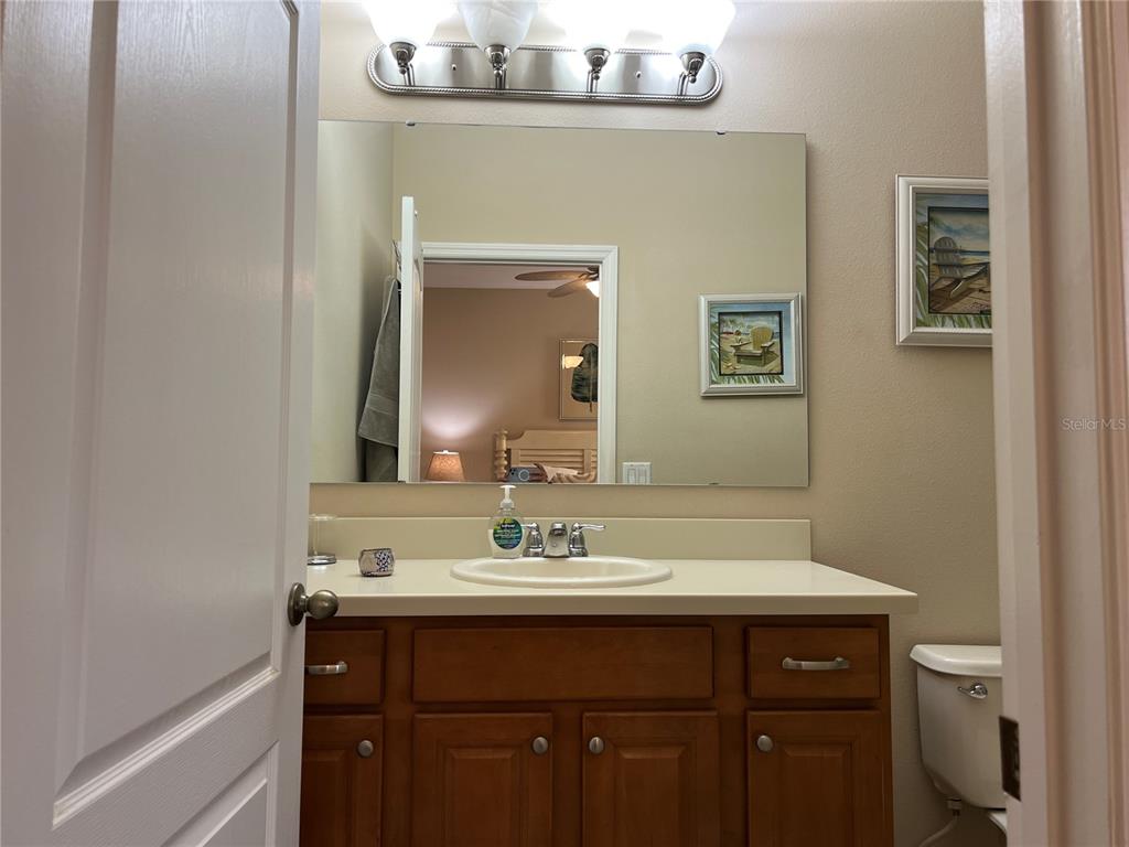 2002 Fishtail Fern Way Ocoee, FL 34761 - Photo 22 of 51 a bathroom with a sink and a mirror