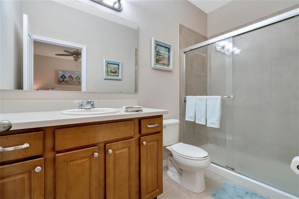 2002 Fishtail Fern Way Ocoee, FL 34761 - Photo 23 of 51 a bathroom with a sink a toilet and shower