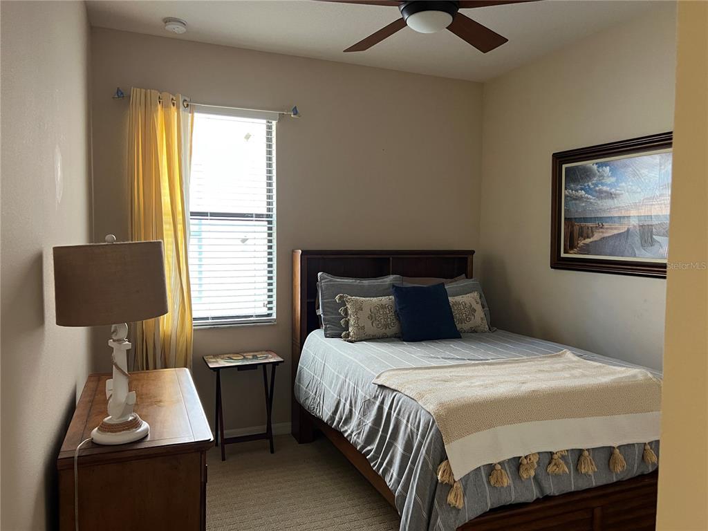 2002 Fishtail Fern Way Ocoee, FL 34761 - Photo 26 of 51 a bedroom with a bed and a window