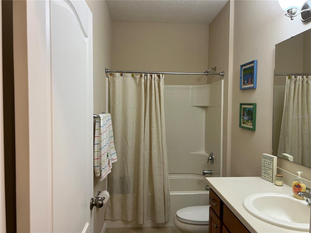 2002 Fishtail Fern Way Ocoee, FL 34761 - Photo 28 of 51 a bathroom with a sink toilet and shower