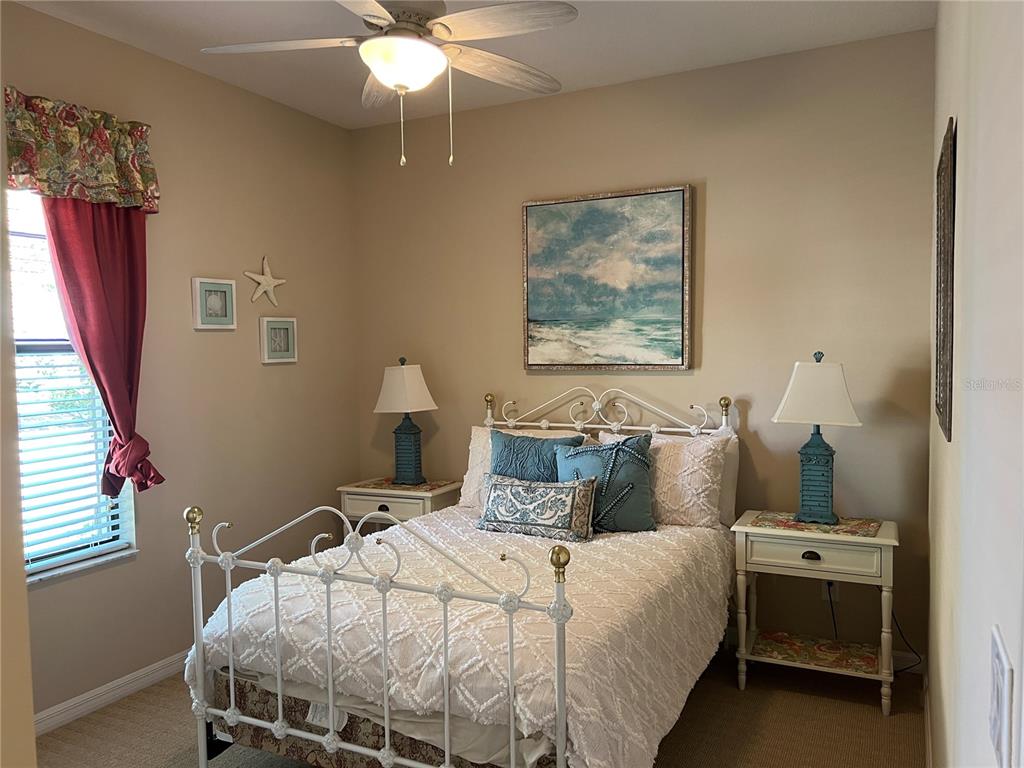 2002 Fishtail Fern Way Ocoee, FL 34761 - Photo 32 of 51 a bedroom with a bed and a chandelier