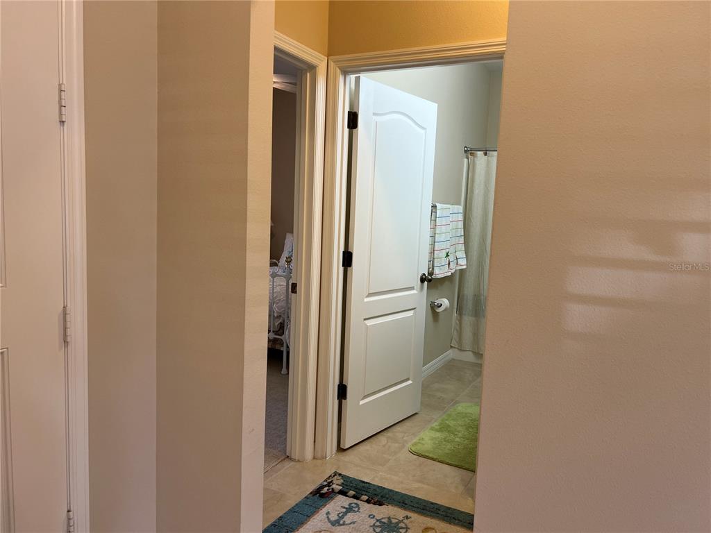 2002 Fishtail Fern Way Ocoee, FL 34761 - Photo 35 of 51 a bathroom with a glass shower door and a sink