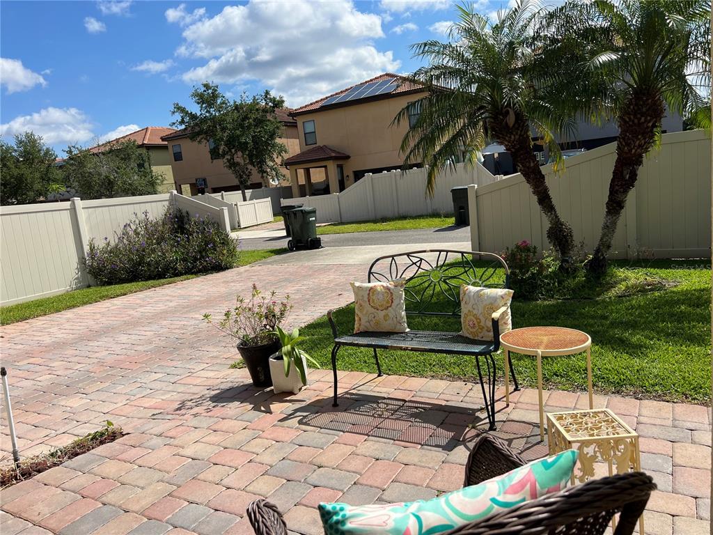 2002 Fishtail Fern Way Ocoee, FL 34761 - Photo 38 of 51 a view of a chairs and table in backyard