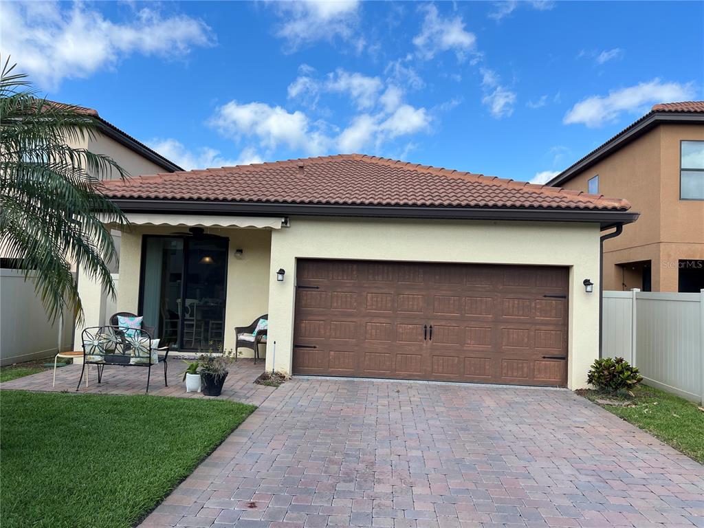 2002 Fishtail Fern Way Ocoee, FL 34761 - Photo 39 of 51 a front view of a house with a yard