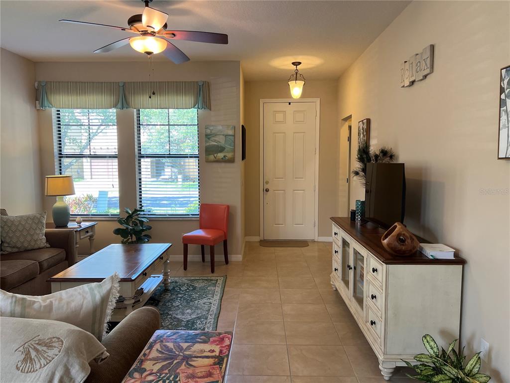 2002 Fishtail Fern Way Ocoee, FL 34761 - Photo 5 of 51 a living room with furniture and a flat screen tv