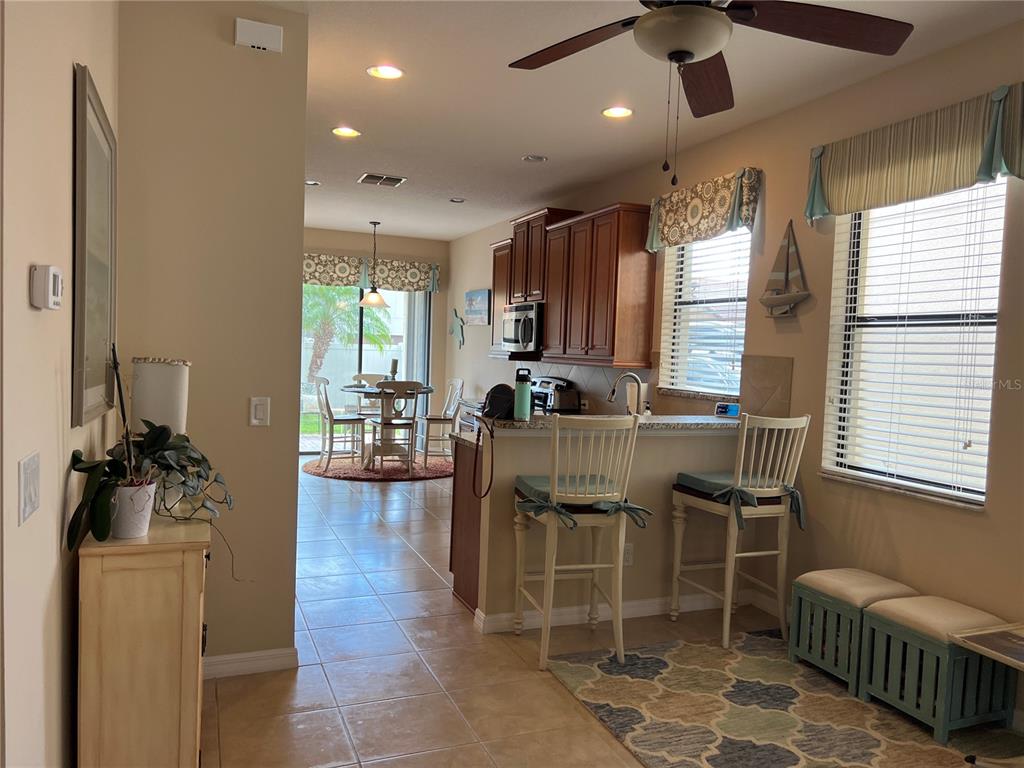 2002 Fishtail Fern Way Ocoee, FL 34761 - Photo 9 of 51 a dining room with furniture and wooden floor
