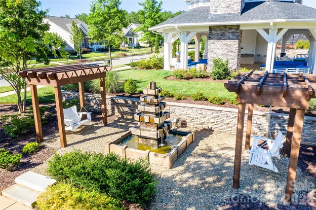 a view of swimming pool with a lounge chairs