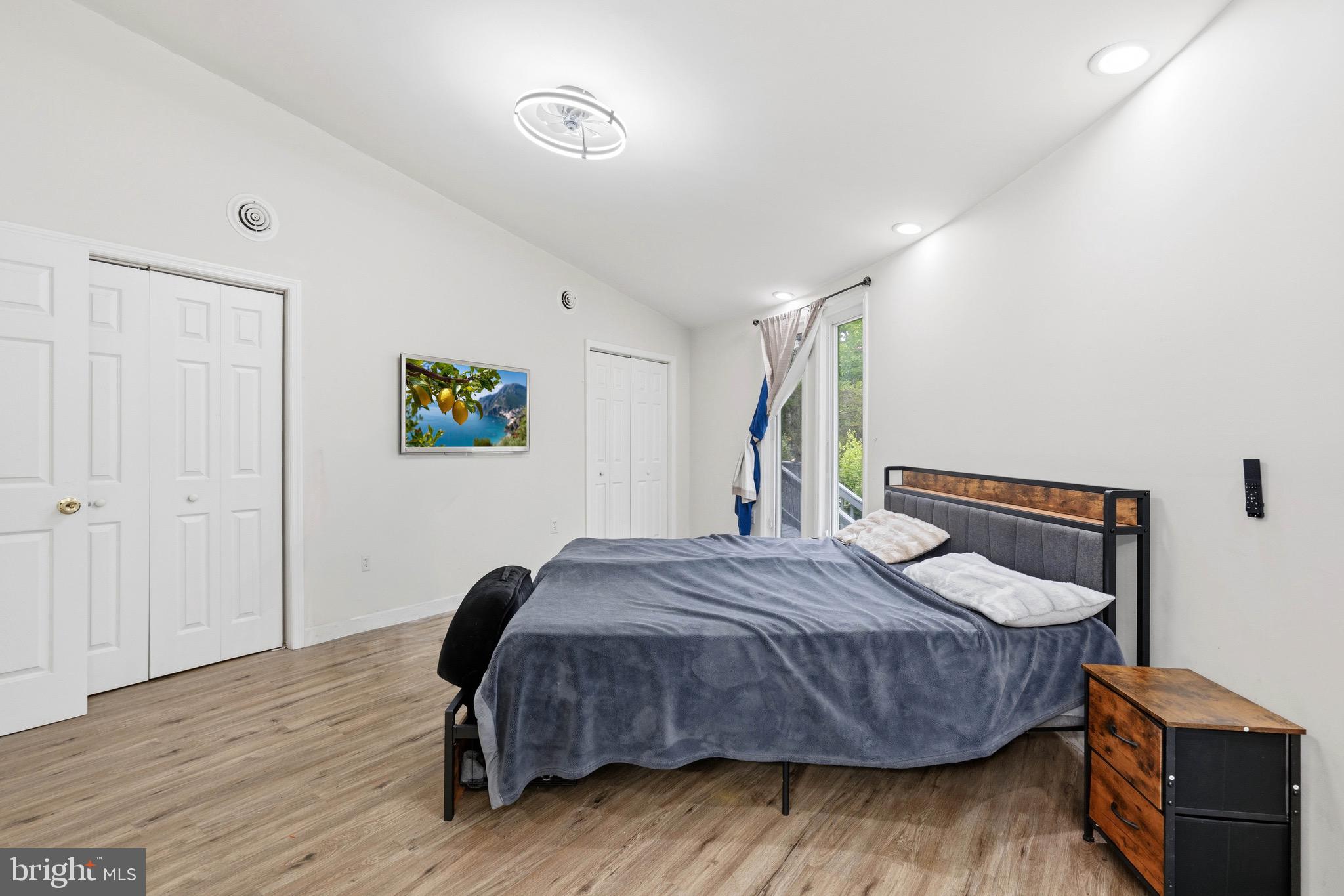 188 Carlisle Place Road Leesburg, NJ 08327 - Photo 23 of 36 a bedroom with a bed and wooden floor