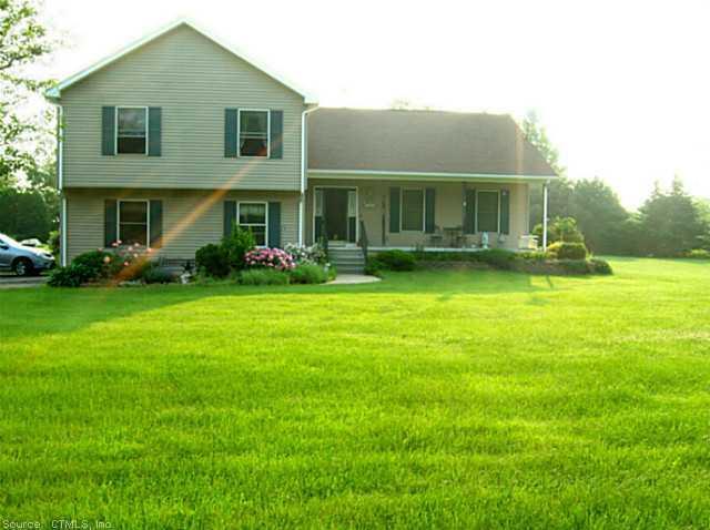 300 Shenipsit Lake Road Tolland, CT 06084 - Photo 1 of 1 a view of a house with a yard and sitting area
