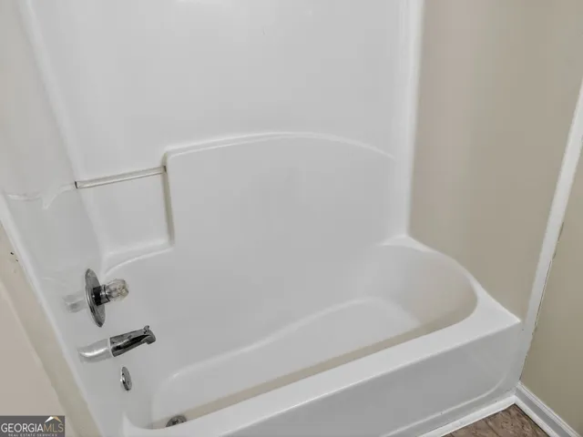 a close up of a bathtub in a bathroom