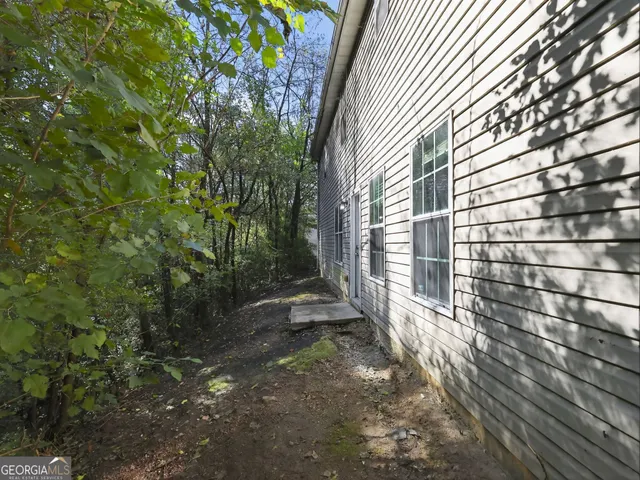 a kitchen with granite countertop stainless steel appliances a stove microwave and oven