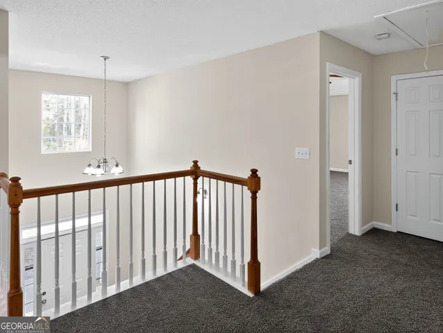 a view of a hallway with windows