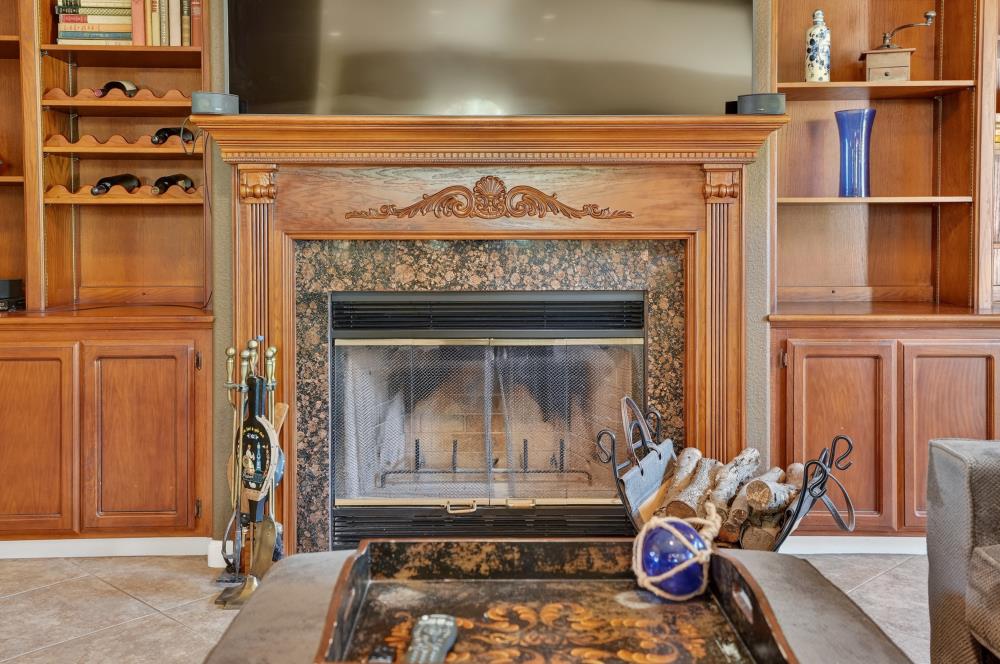 6504 Swallowsview Court Rocklin, CA 95677 - Photo 11 of 66 a living room with furniture and a fireplace