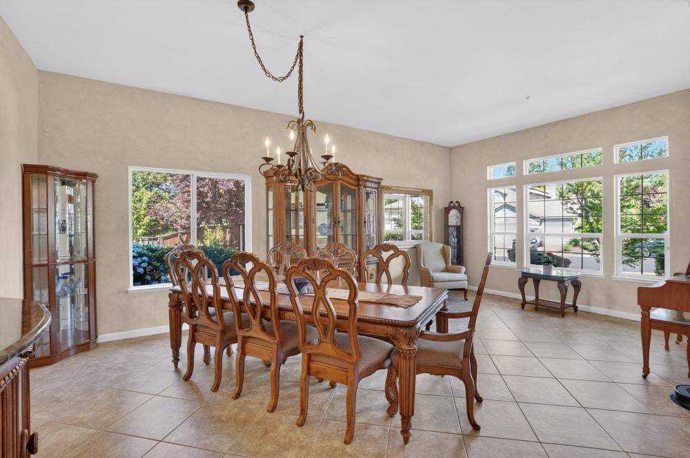 6504 Swallowsview Court Rocklin, CA 95677 - Photo 23 of 66 a view of a dining room with furniture window and outside view