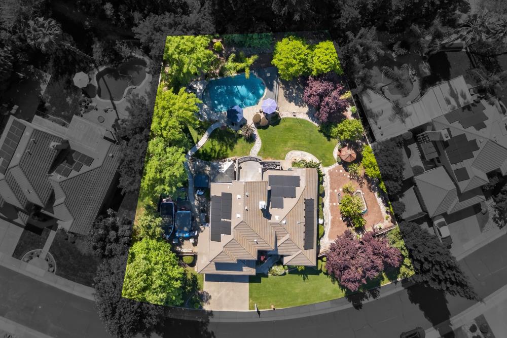 6504 Swallowsview Court Rocklin, CA 95677 - Photo 3 of 66 an aerial view of a house with a yard and flower plants