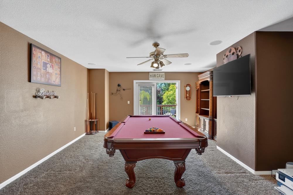 6504 Swallowsview Court Rocklin, CA 95677 - Photo 36 of 66 a living room with furniture pool table and flat screen tv