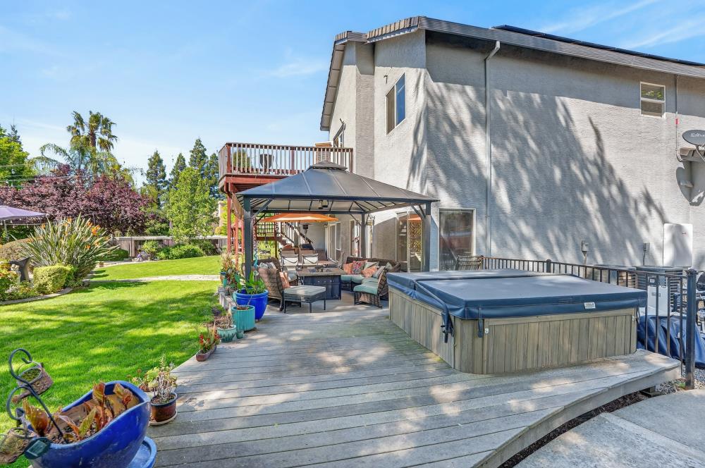 6504 Swallowsview Court Rocklin, CA 95677 - Photo 52 of 66 a view of a chairs and table in backyard of the house