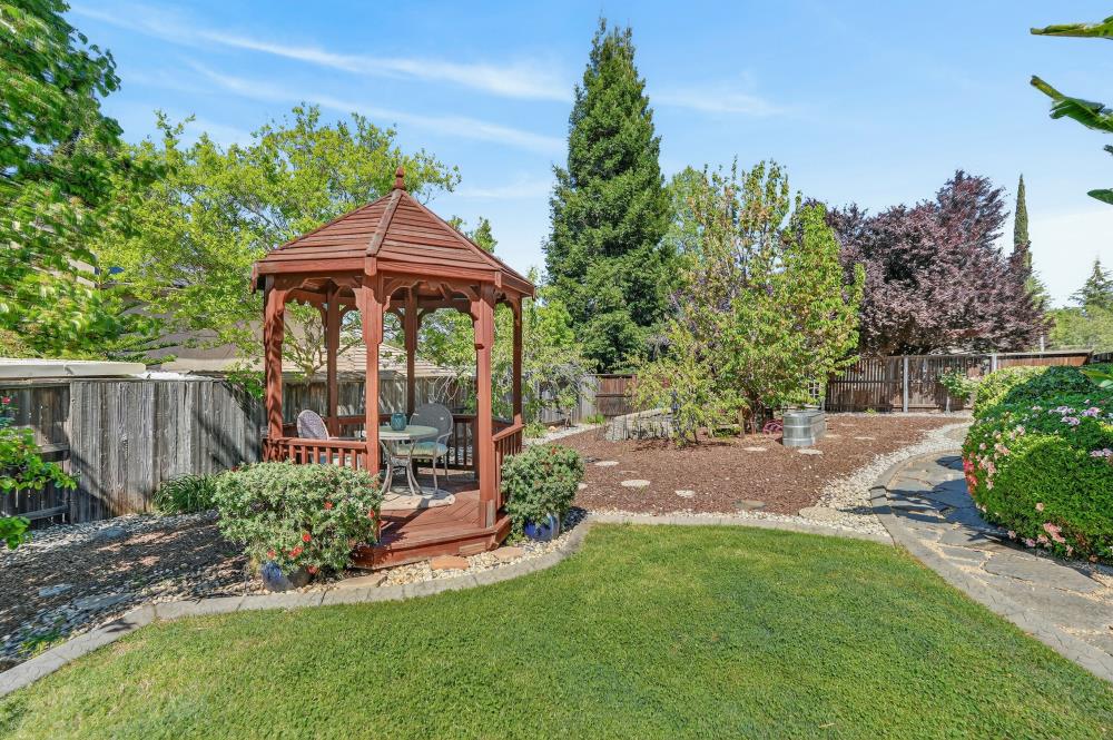 6504 Swallowsview Court Rocklin, CA 95677 - Photo 59 of 66 a view of a garden with an outdoor seating