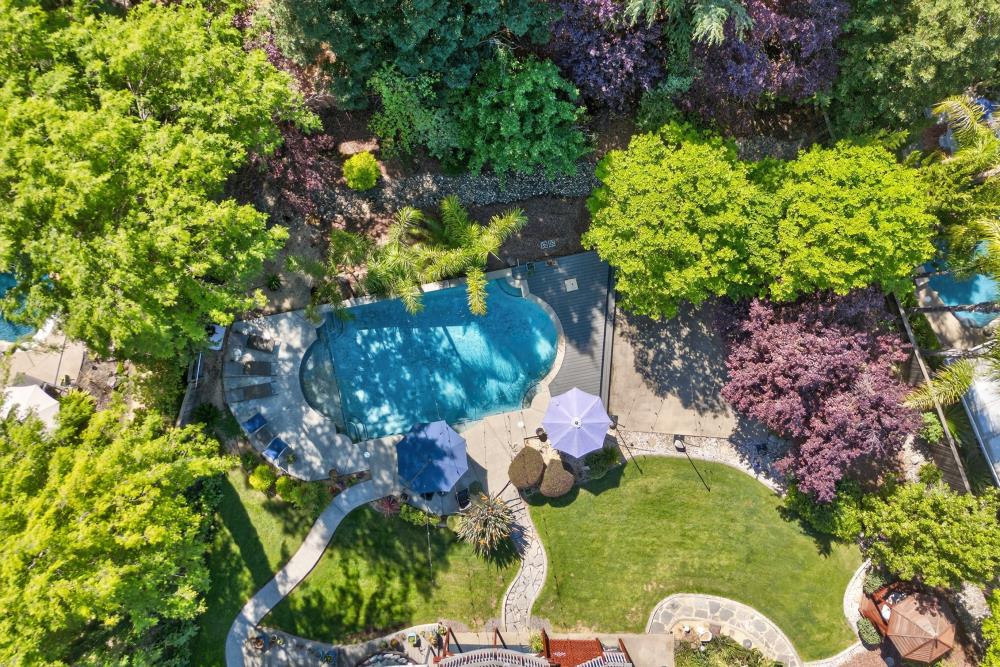 6504 Swallowsview Court Rocklin, CA 95677 - Photo 65 of 66 a backyard of a house with a yard and outdoor seating