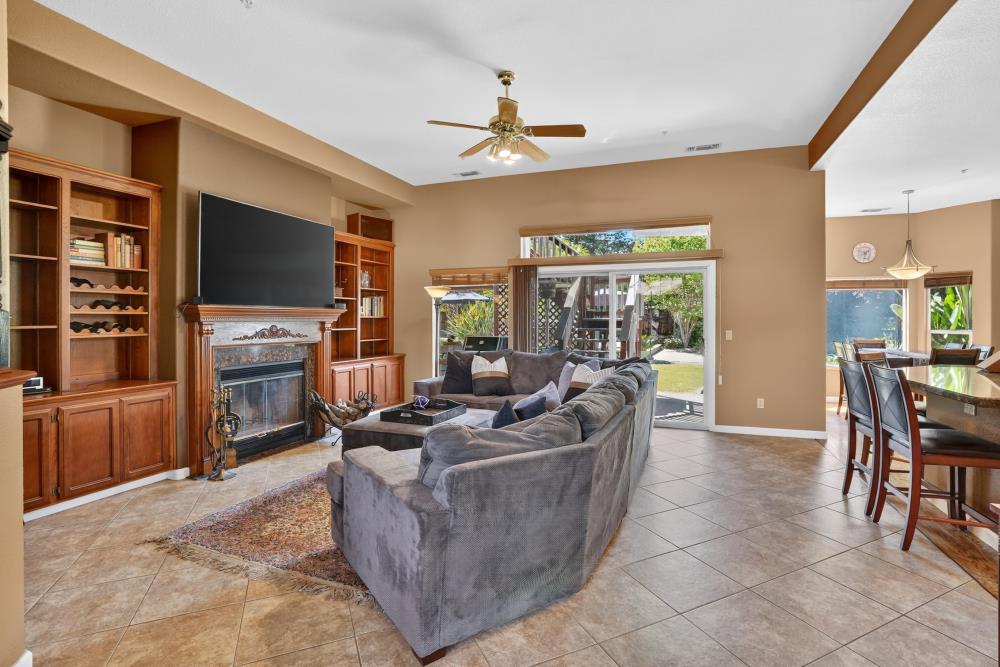 6504 Swallowsview Court Rocklin, CA 95677 - Photo 7 of 66 a living room with furniture and a flat screen tv