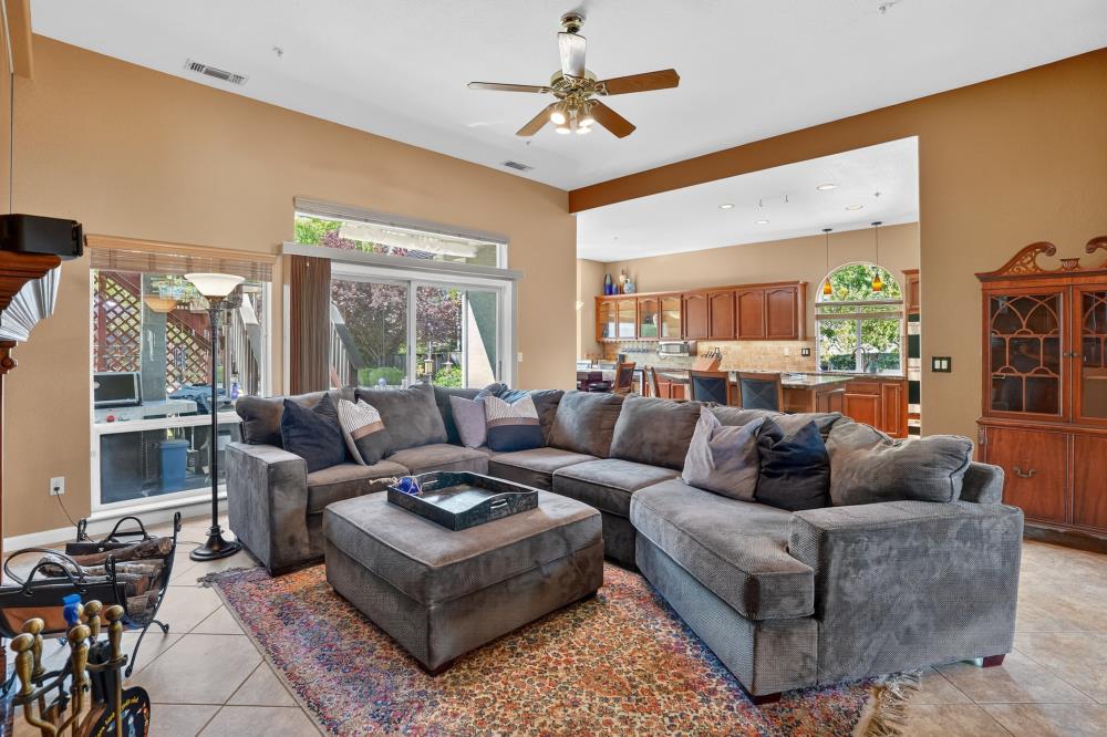 6504 Swallowsview Court Rocklin, CA 95677 - Photo 8 of 66 a living room with furniture ceiling fan and a large window